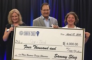 CIED director Sue Carter (left) and Kamil Hasan present the 1st place prize in the the 2018 Business Design Showcase